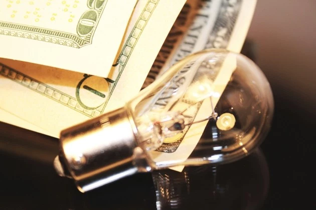 Lamp and banknotes as energy saving concept idea